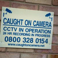 Caught on camera sign on brick building
