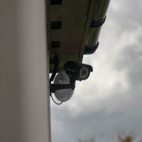 Black CCTV camera on Royal Veterinary College in London