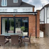 External view of home extension with security camera