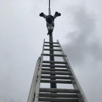 Ladder reaching up to CCTV installation at school