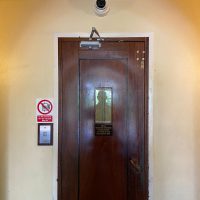 CCTV camera above wooden door