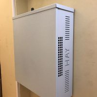 Metal case on wall hiding electrics