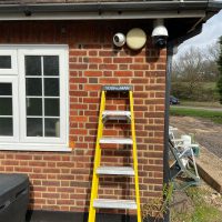 Essex home with CCTV cameras and yellow ladder