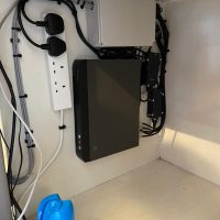 Closeup of cctv system connected to plug sockets